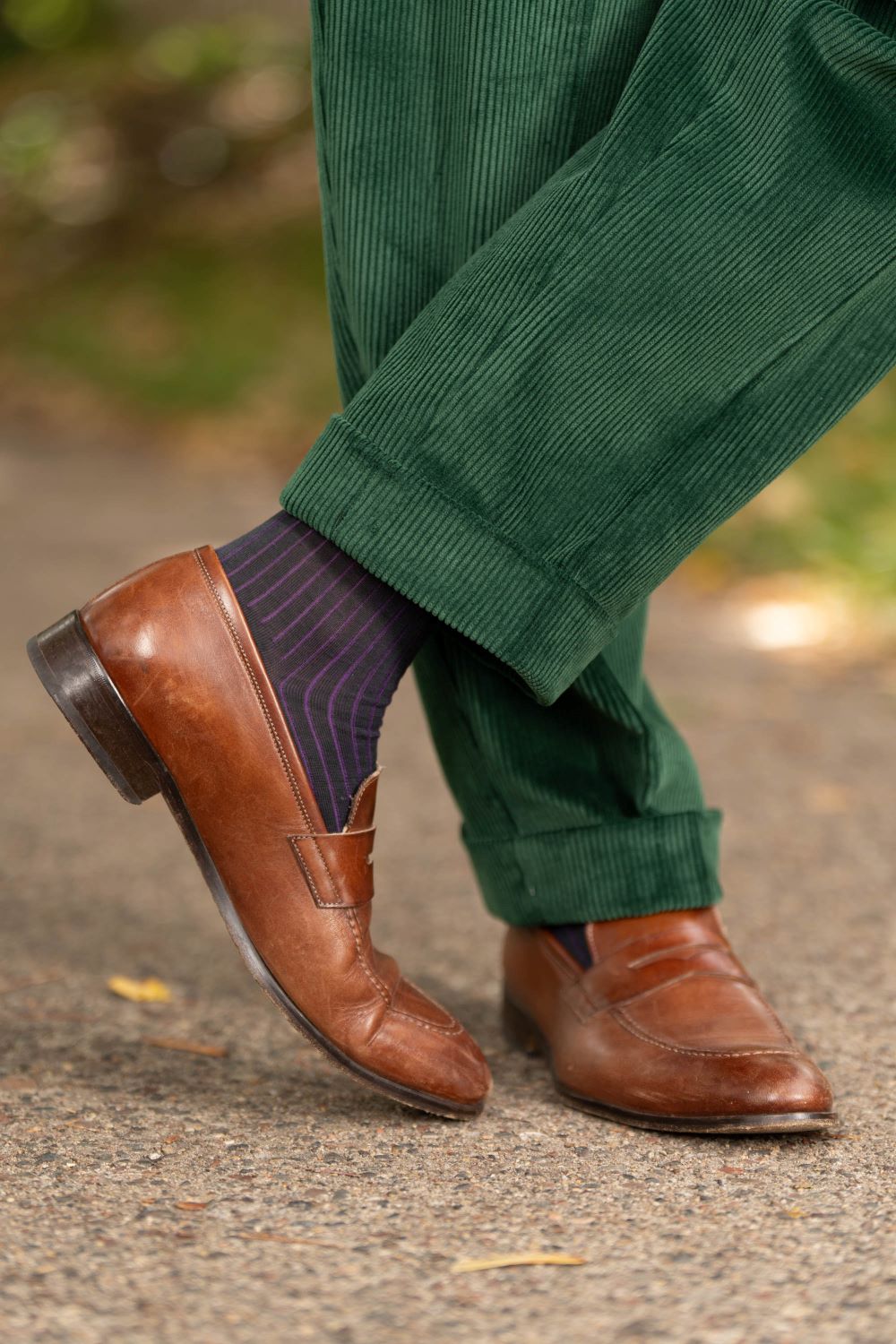 Brown loafers, shadow striped socks in dark green and purple as well as British Racing Green Stancliffe Corduroy Trousers by Fort Belvedere