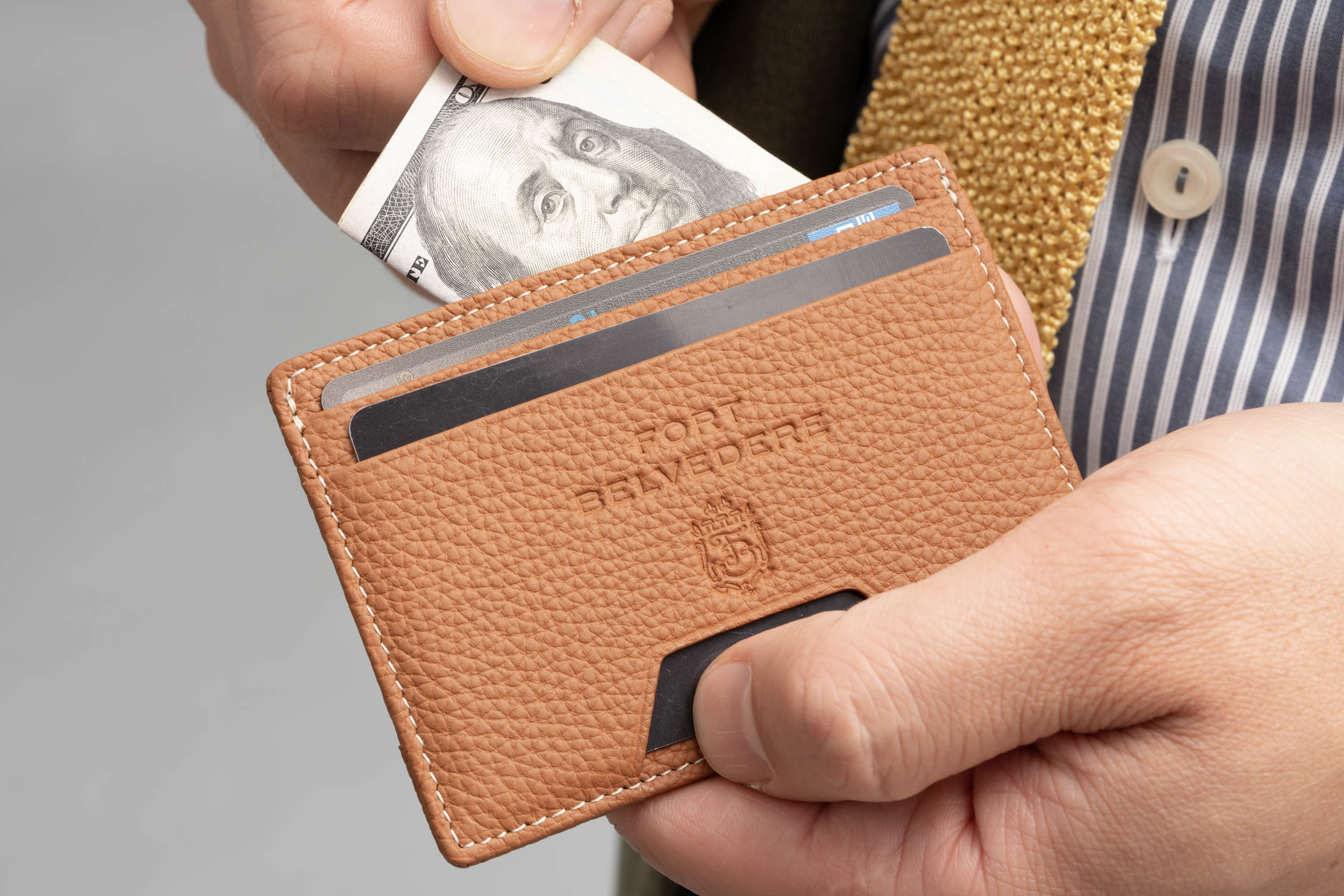 Golden Brown Full-Grain Leather 4CC Wallet can hold bills and cards.