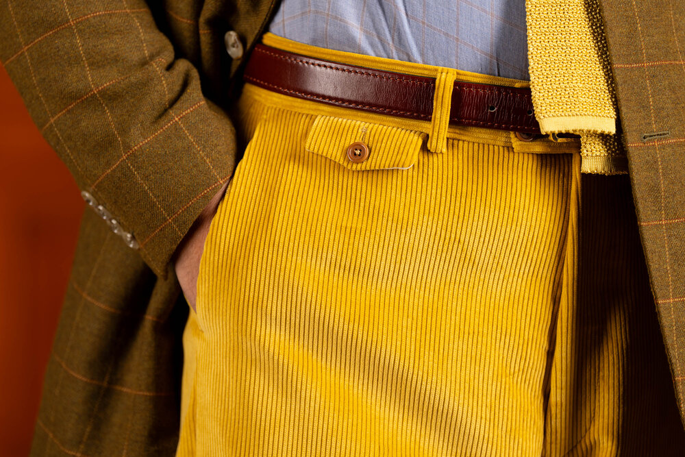 Details of Stancliffe corduroy pants with flapped ticket pocket modelled in an outfit.