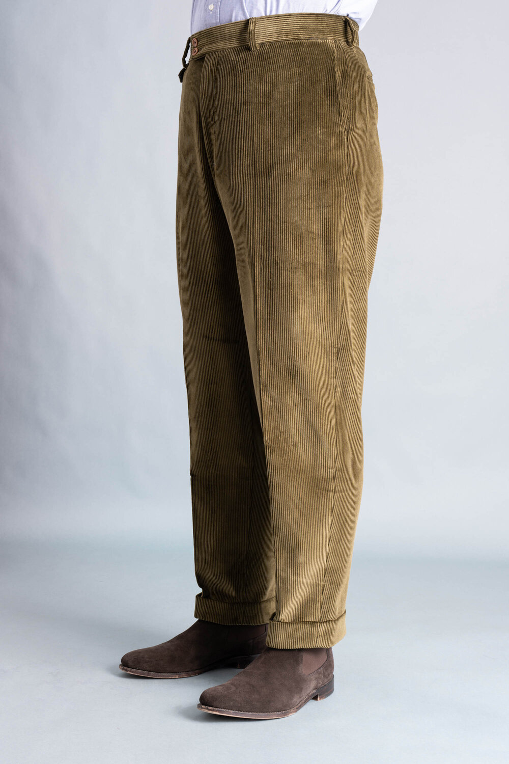 Left side angle front view of the Khaki Drab corduroy trousers.
