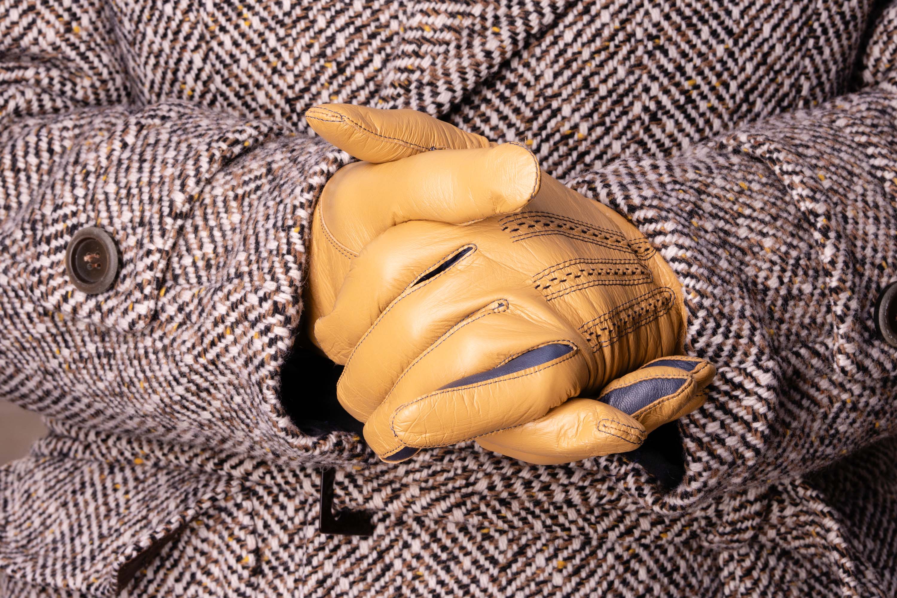 Light Tan Lamb Nappa Touchscreen Gloves with Denim Blue Contrast Focused Image When Worn