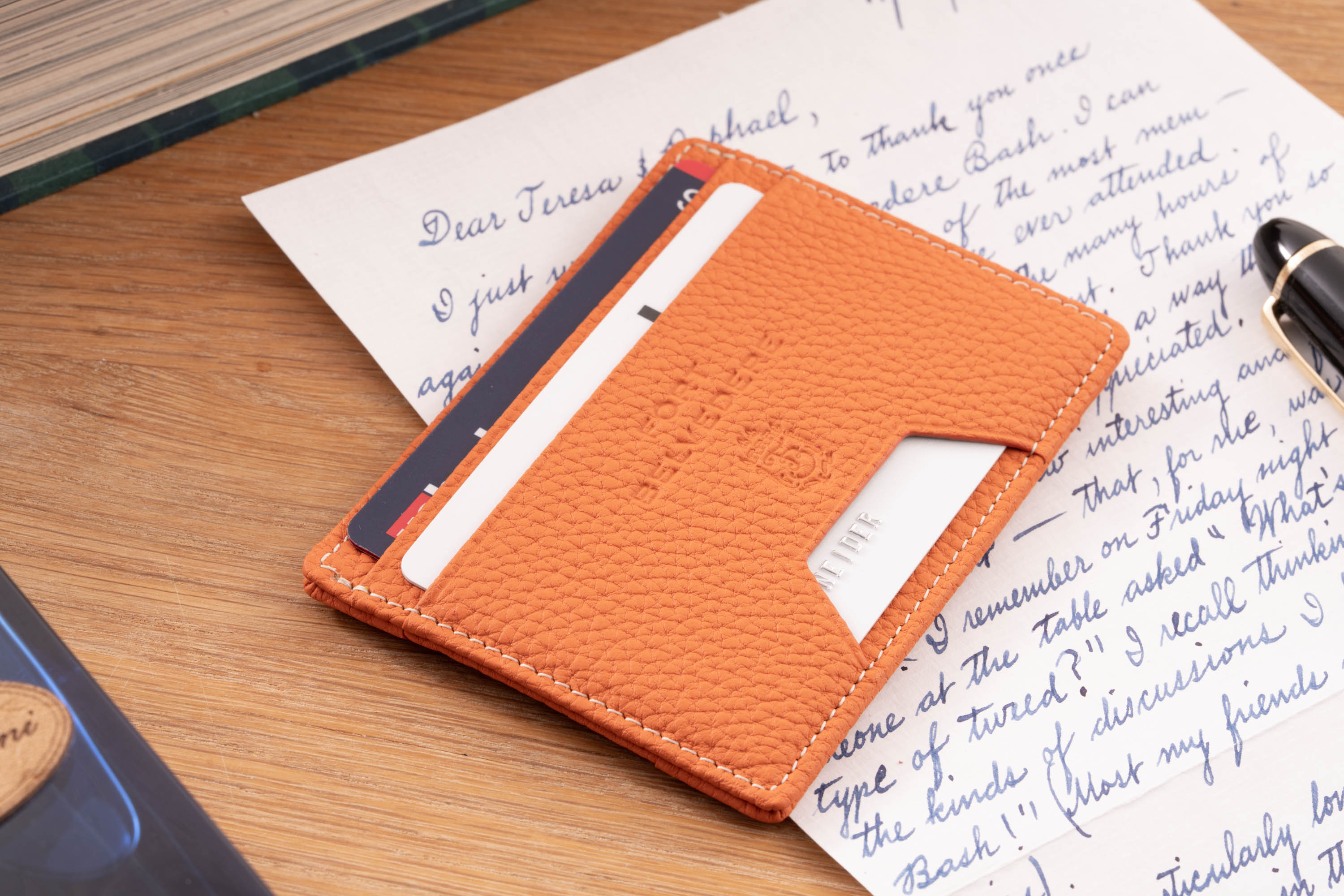 Orange Togo  Full-Grain Leather 4CC Wallet becomes more beautiful as they age.