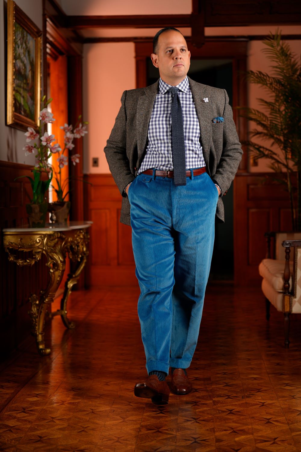 Raphael wearing a gray sport coat paired with an azure blue colored corduroy