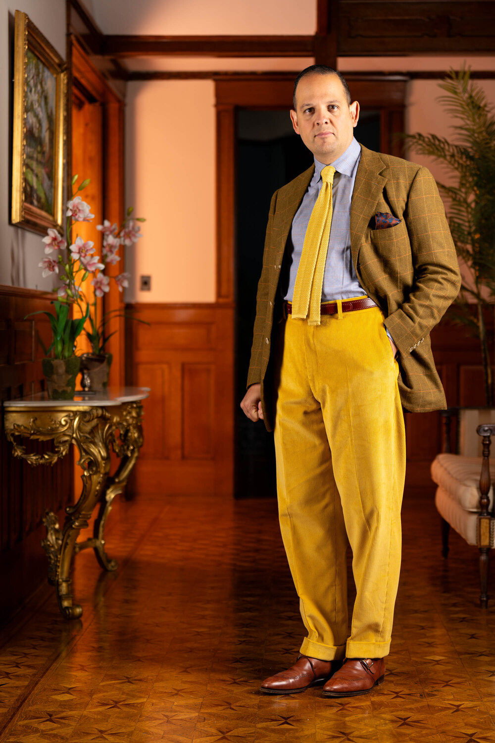 Raphael wearing the vibrant goldenrod corduroy trousers.