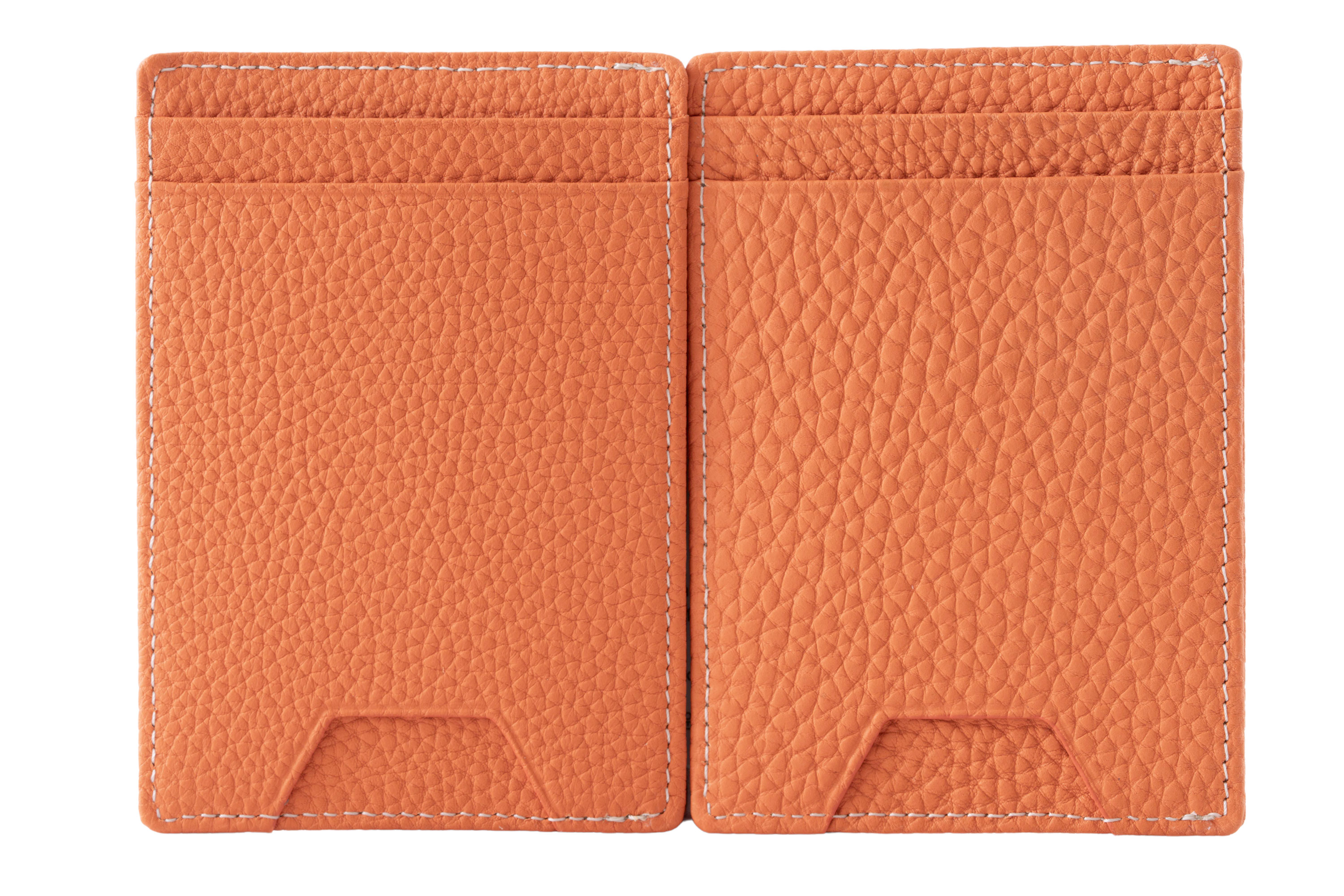 Orange Togo  Full-Grain Leather 4CC Wallets next to each other Our shrunk calf togo leather is naturally shrunk and not embossed. Therefore every wallet has a unique pebble grain in different sizes. 