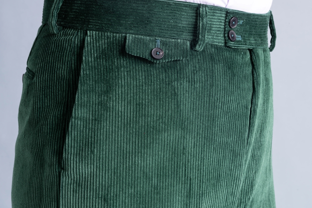 Detailed side view of pocket, ticket pocket, waistband, and fly of Stancliffe Corduroy Trousers by Fort Belvedere in British Racing Green